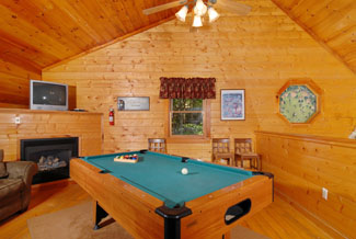 Pigeon Forge Four Bedroom Cabin Featuring A Lofted Game Room with Pool Table, Dart Board, and Fireplace